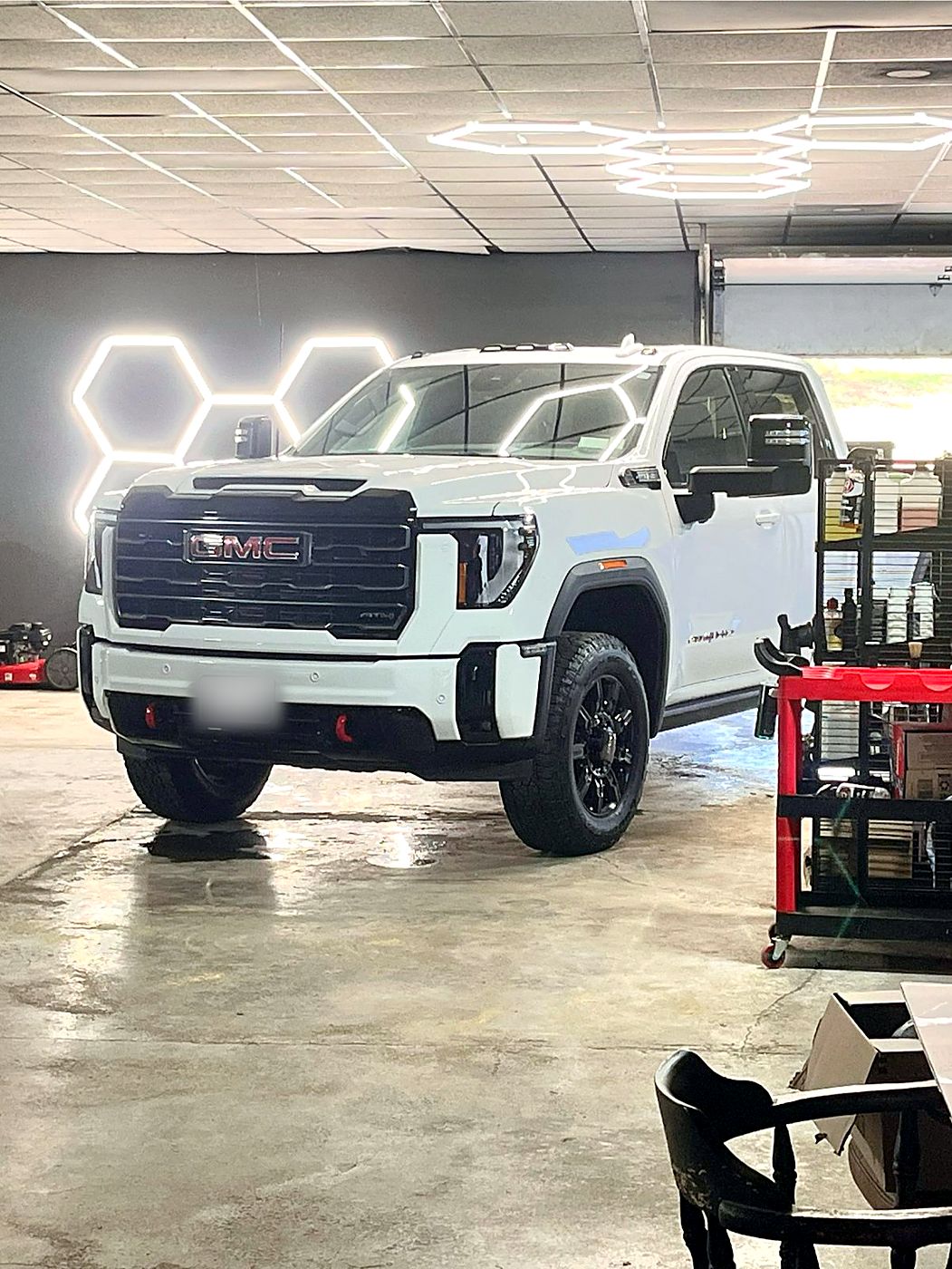White GMC Sierra in the detailing bay